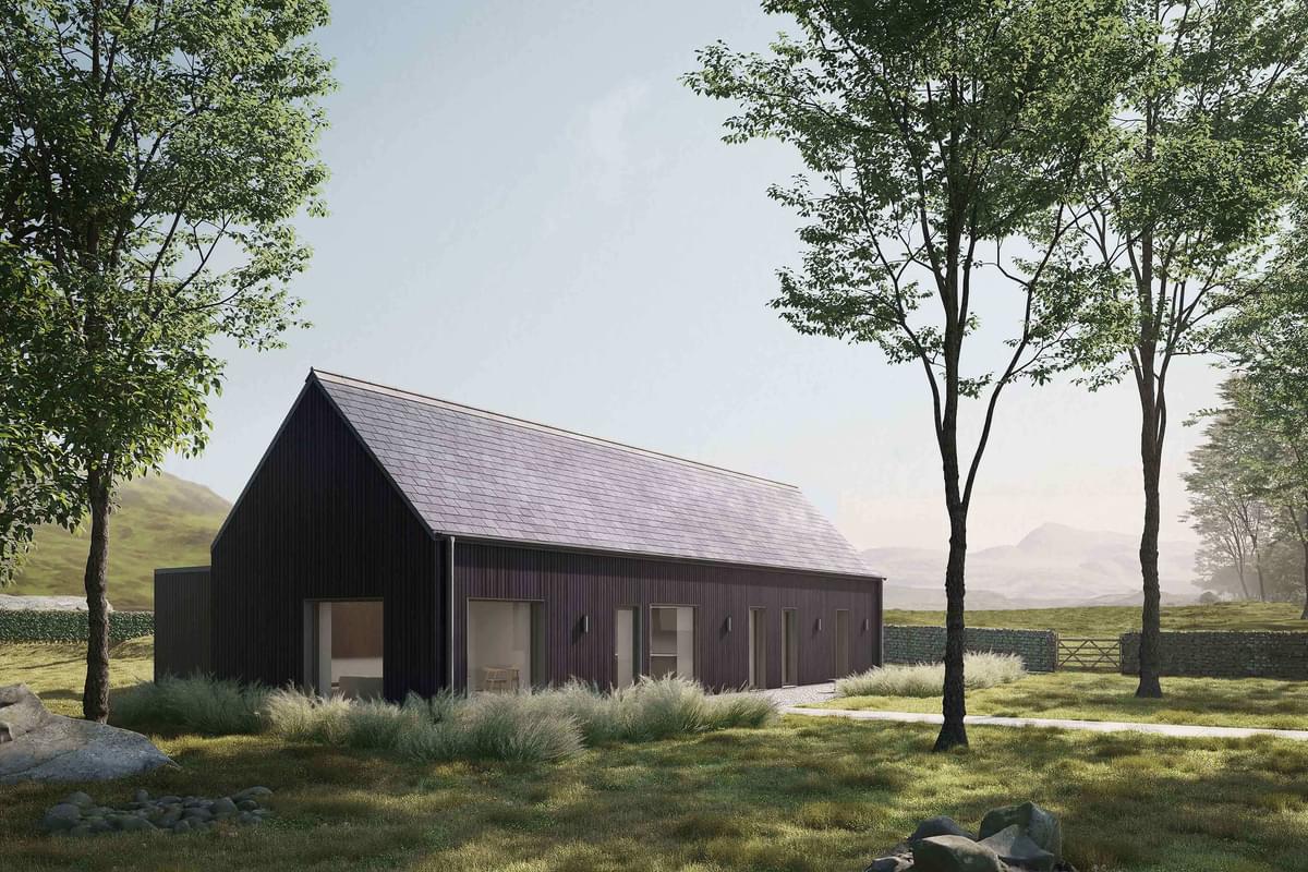 Side exterior of the Coldwells Build Passivhaus, Argyle. A prefabricated bungalow with black cladding and a grey pitched slate roof.