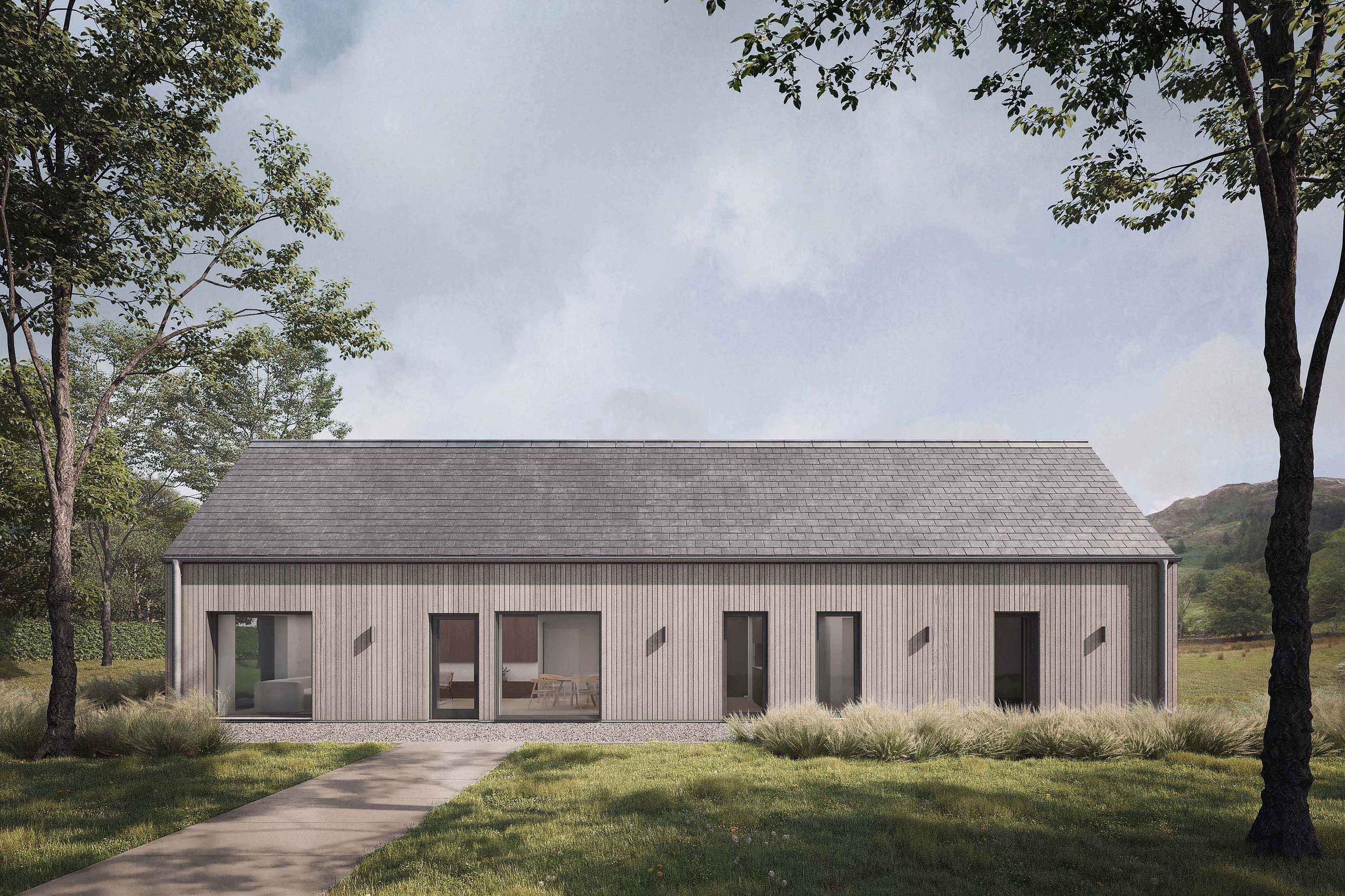 Front on exterior of the Coldwells Build Passivhaus, Argyle. A prefabricated bungalow with oak cladding and a grey pitched slate roof.