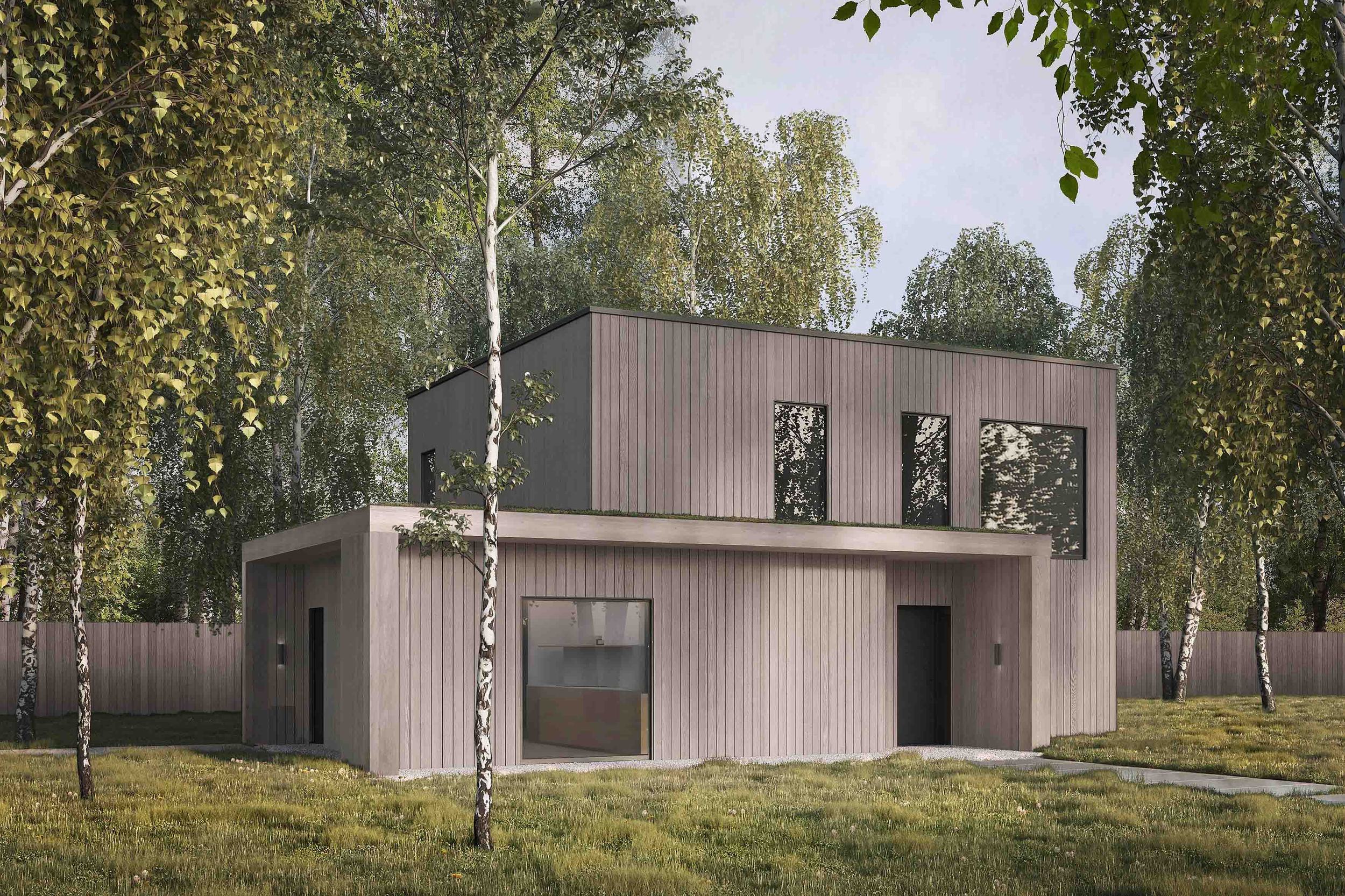 Exterior of the Coldwells Build Passivhaus, Foster. Oak cladding with a sedum roof in a forest setting.