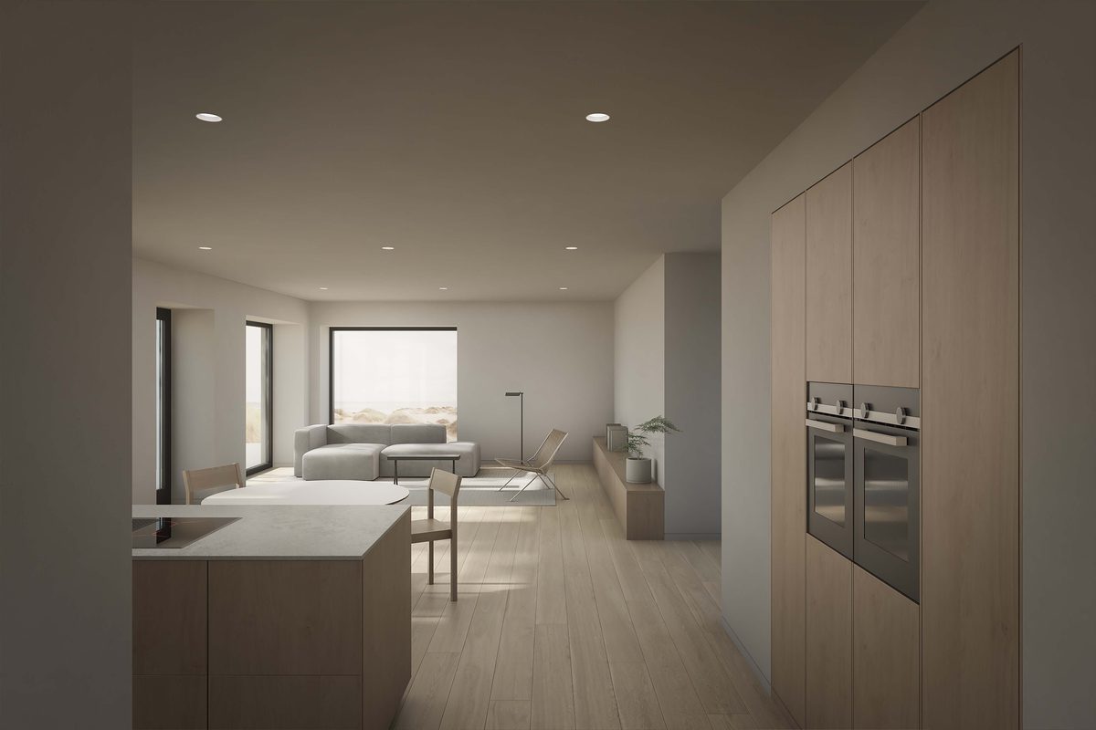 Living and kitchen space of the Coldwells Build Passivhaus, Irving. Oak cabinetry with large windows and grey furnishings.