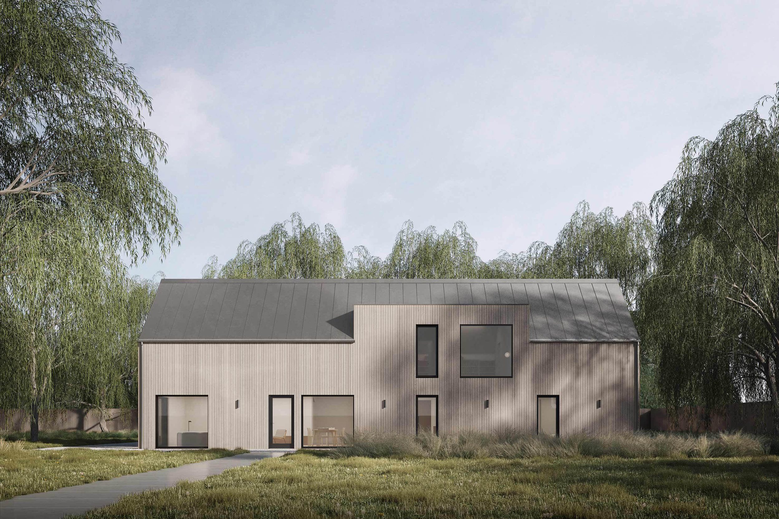 Exterior of the Coldwells Build Passivhaus, McKinley. Oak clad prefabricated home with large windows, dark metal roof in a large garden with willow trees.